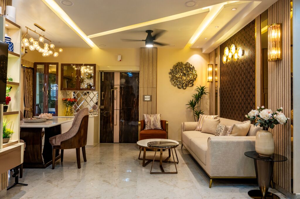 pexels-photo-36601409-36601409 Luxurious living room with modern decor, beige sofa, marble flooring, and elegant lighting.
